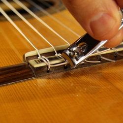 trim guitar string tail