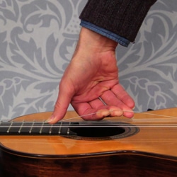 stretch new guitar strings