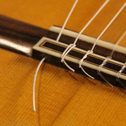 change classical guitar strings tie knot