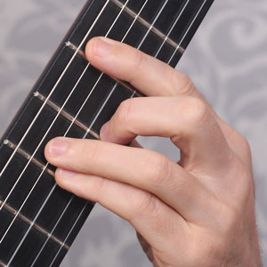 B minor guitar hand chord