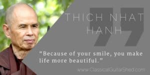 Thich Nhat Hanh smiling guitar practice