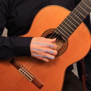playing at an angle to the strings